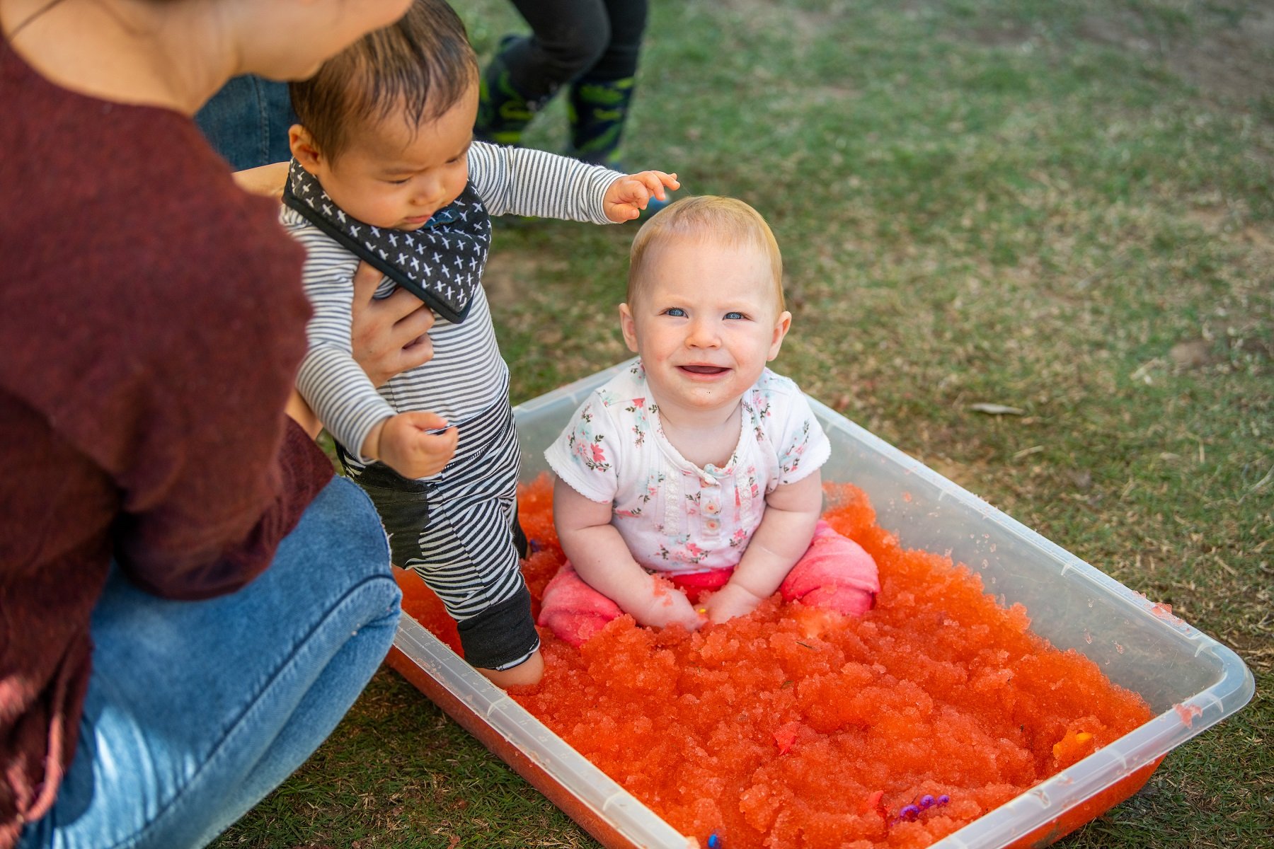 Babies enjoying messy sensory play together