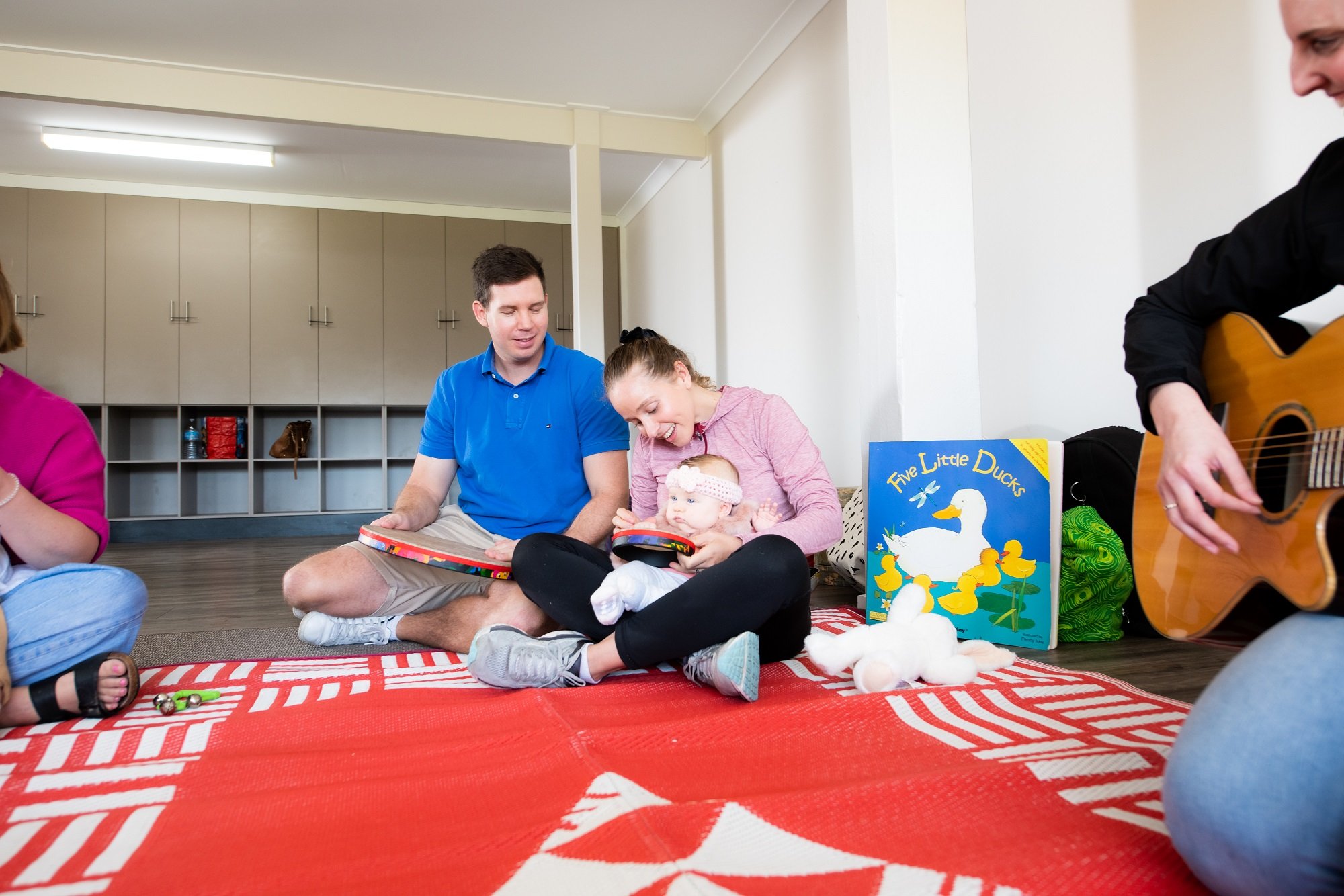 Parents enjoying Play Matters music session with their baby