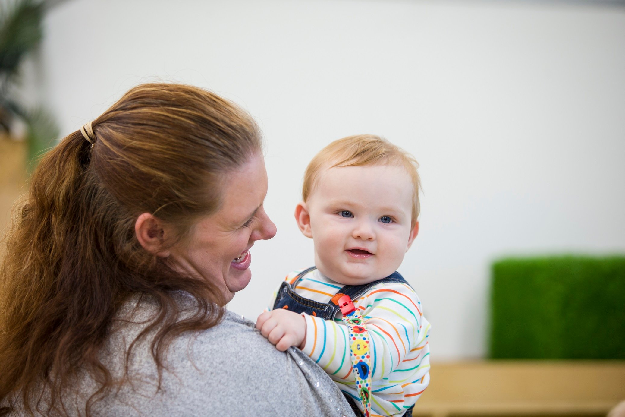 Parent singing to baby