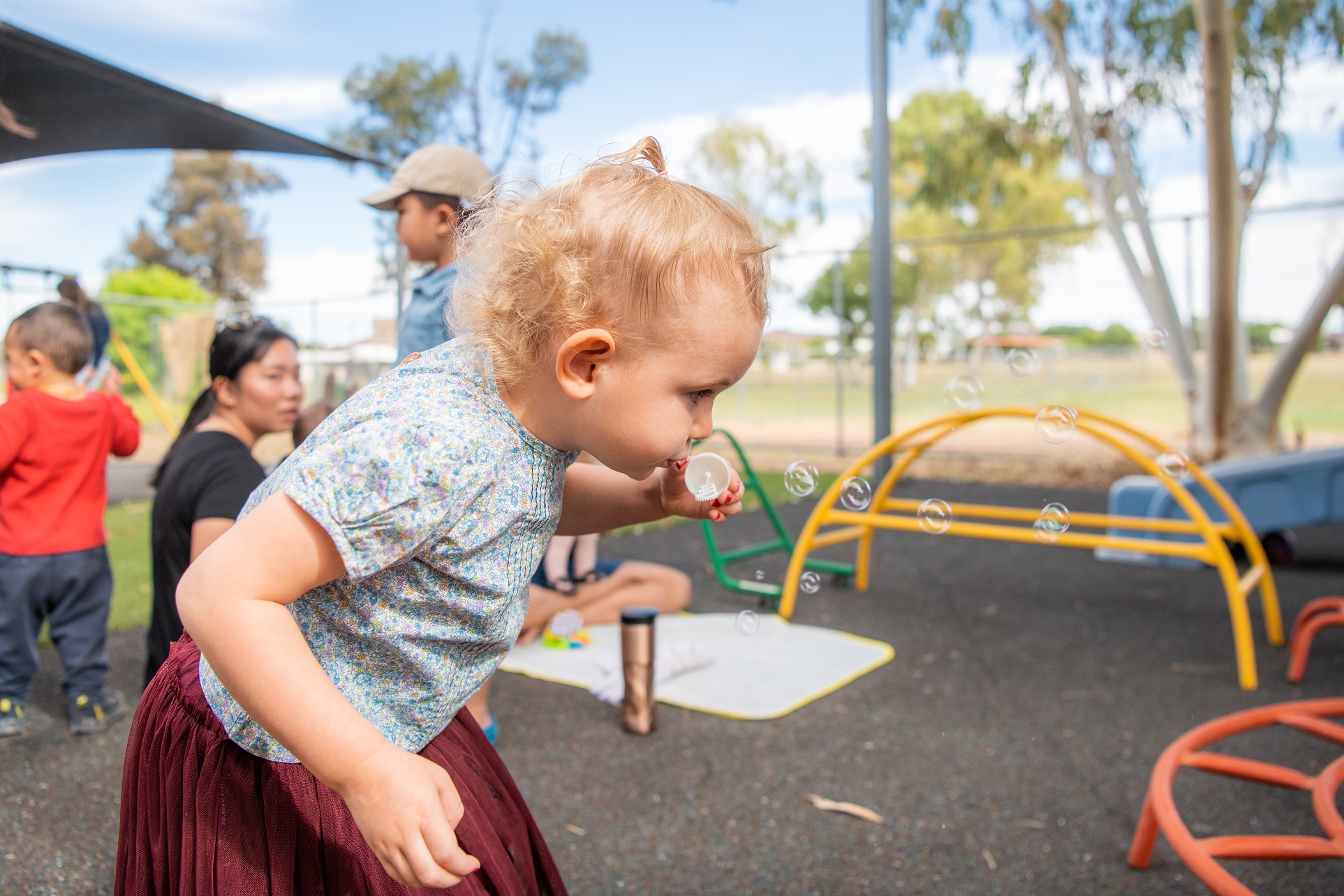 Child blowing bubbles