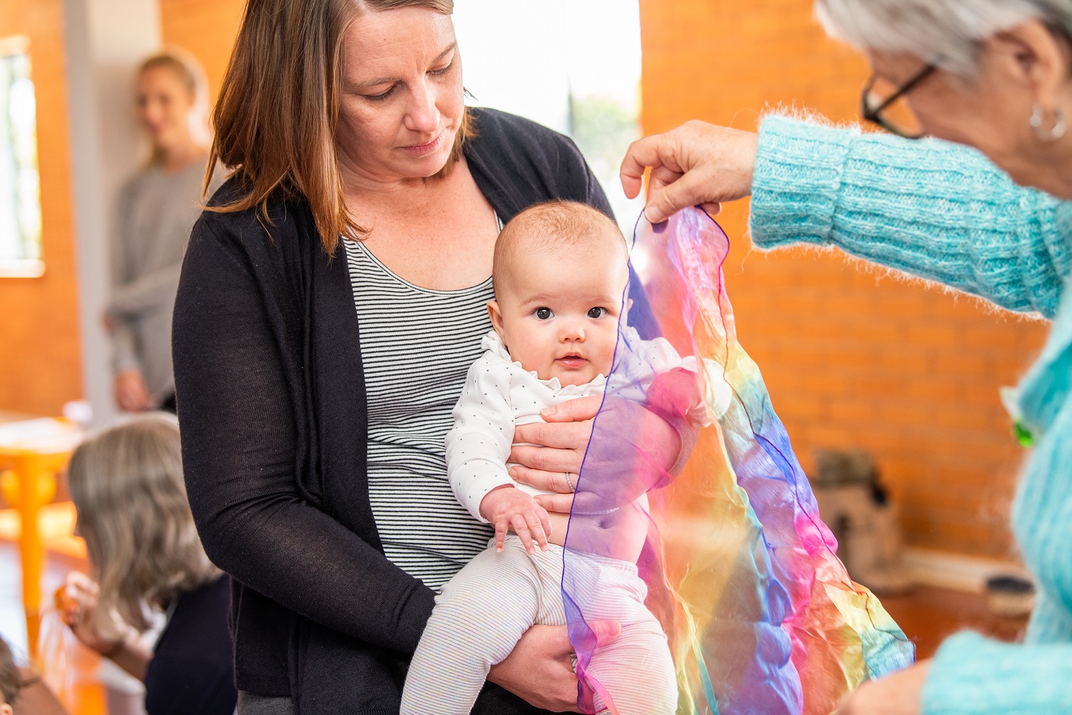 Baby and mother with ribbon